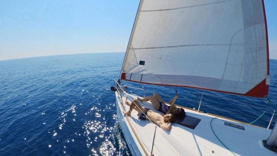Barcelona: 2-Hour Sunset Sailboat Trip - Swimming, paddle boarding, and floating in the sea