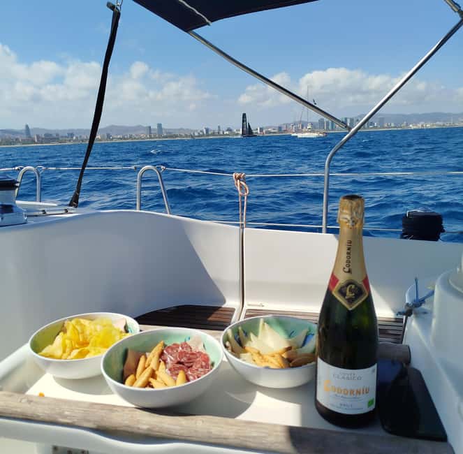 Barcelona Badalona : Sailboat Tour, Snacks, Drinks, Swimming - The first hour on the Mediterranean