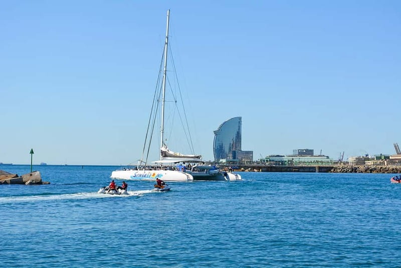 Barcelona: Catamaran Party Cruise with BBQ Meal - Music, dancing, and the crew
