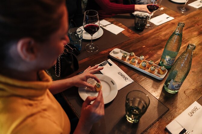 Barcelona: Guided Food Walking Tour with Tapas and Wine - First tapas stop on Carrer Ample