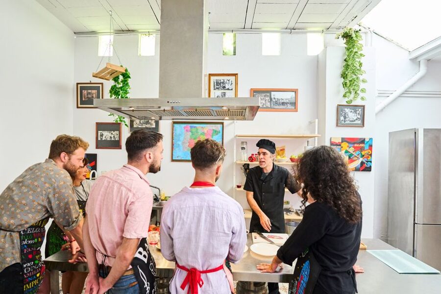 Barcelona: Paella Cooking Class with Market Visit and More - Sitting down to eat what you made