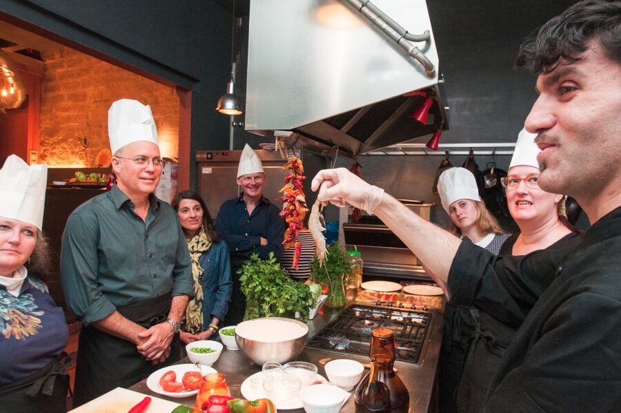Barcelona: Paella Cooking Experience & Boqueria Market Tour - Mixing sangria while the rice simmers
