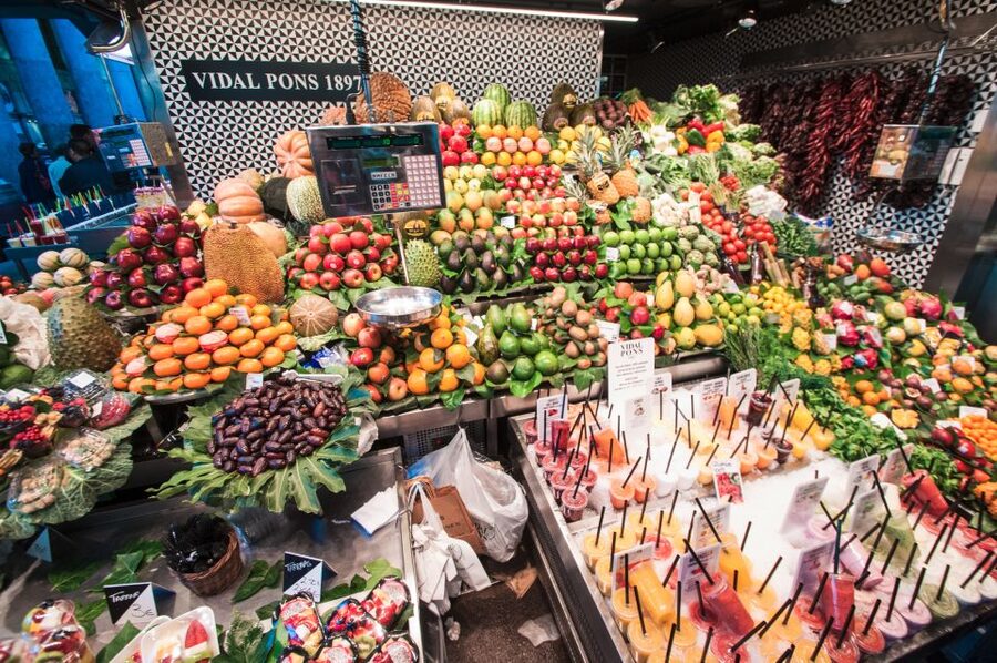 Barcelona: Paella Cooking Experience & Boqueria Market Tour - Sitting down to the seafood paella
