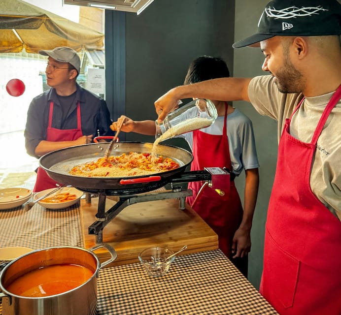Barcelona: Seafood Paella ★Maestro★ & Tapas & Sangria - Preparing pan con tomate, tapas, and local accompaniments