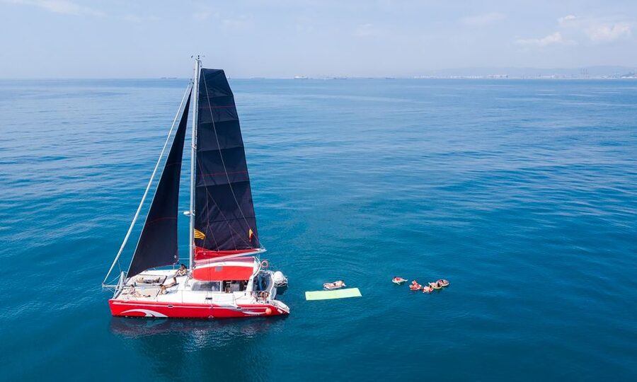 Barcelona: Sunset or Day Catamaran Cruise with Tapa & Drink - Leaving Marina Vela beside Barceloneta