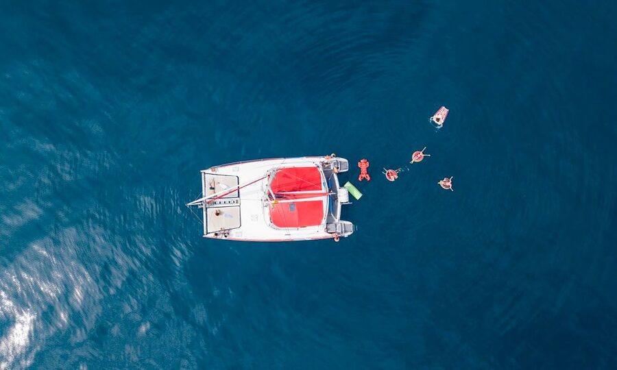 Barcelona: Sunset or Day Catamaran Cruise with Tapa & Drink - What the crew adds to the experience