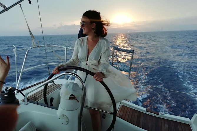 Barcelona Sunset Sailing Cruise from Port Olímpic with Open Bar - Hoisting the sails beyond the port