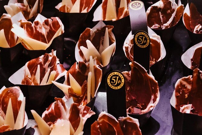 Barcelona Tapas Walking Tour: Food, Wine & History - Walking the Gothic Quarter between four local stops