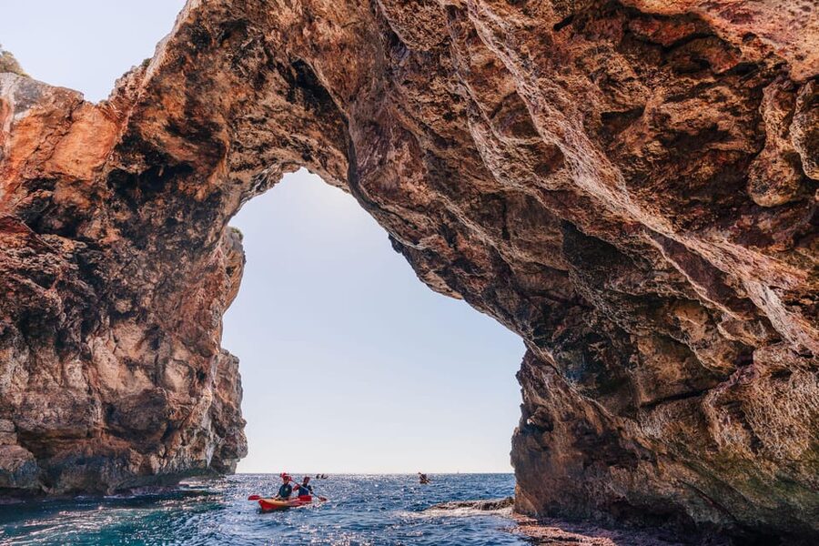 Cala Varques: Guided Sea Caves Kayak & Snorkeling Expedition - Paddling toward the caves