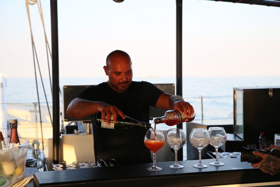Cambrils: Sunset Catamaran Cruise with Drinks - Swimming and snorkeling when the sea allows