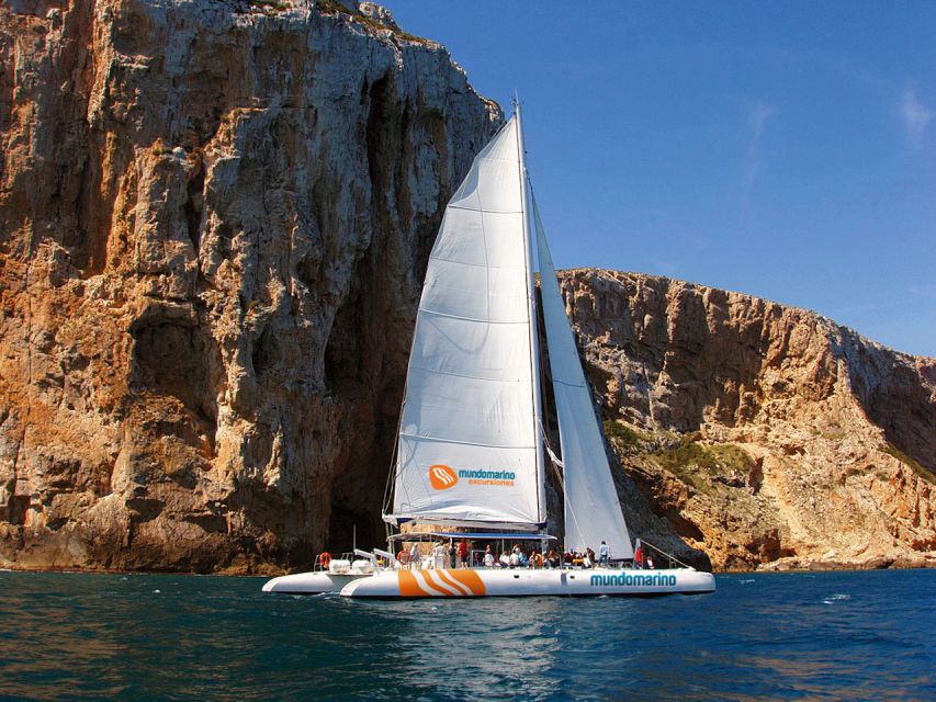 Dénia & Jávea: Portixol Sailing Catamaran Excursion with BBQ - Coastline views, coves, and steep cliffs