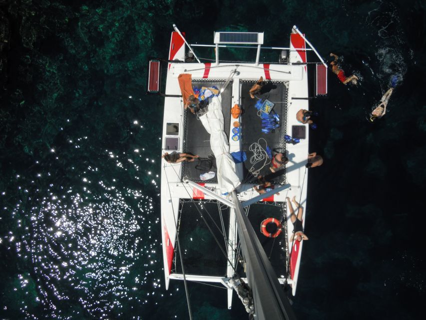 From Fornells: Half-Day Menorca Catamaran Trip w/ Snorkeling - The guide and the small-group feel