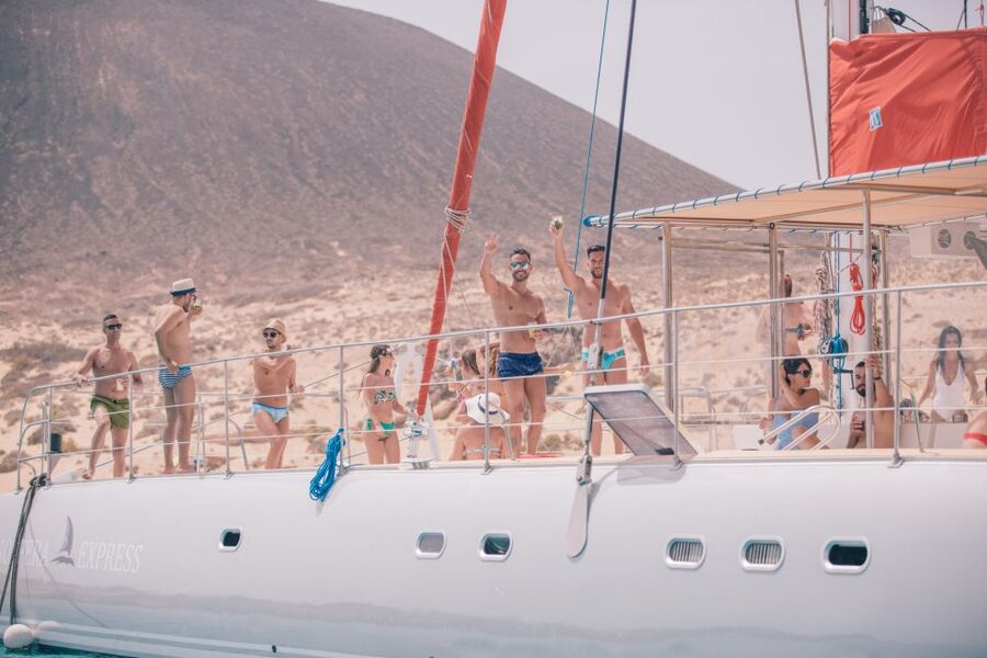 From Lanzarote: Sailing Day Trip Around La Graciosa - Boarding the catamaran near Caleta de Sebo