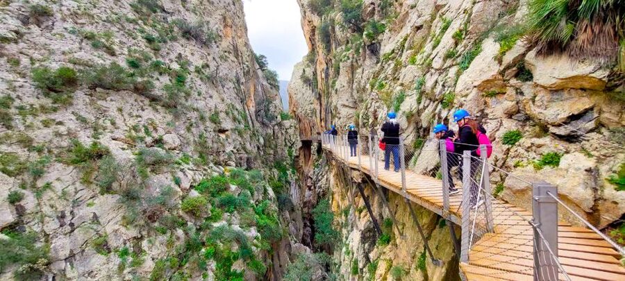 From Málaga: Caminito del Rey Guided Day Trip - Entering Gaitanes Gorge with a helmet