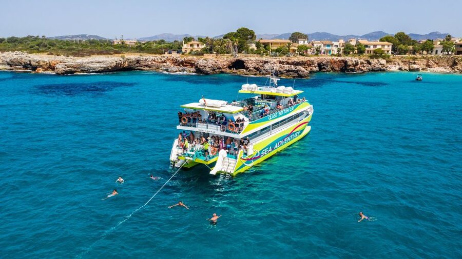 From Porto Cristo: East Coast Glass-Bottom Boat Trip - The Calas de Mallorca shuttle is a different kind of boat day