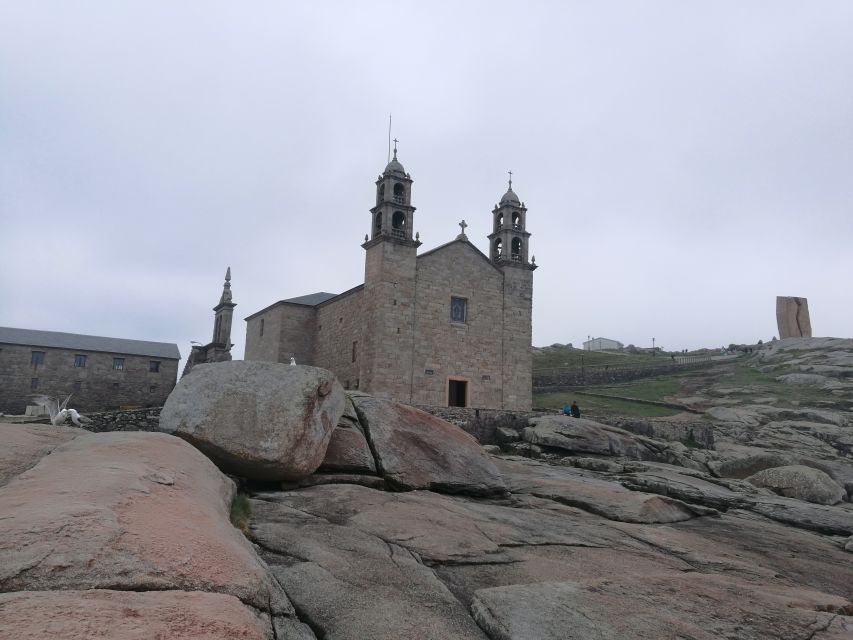 From Santiago: Finisterre, Muxia & Costa da Morte Excursion - Cape Finisterre gives the tour its headline view