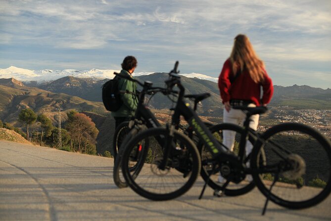 Granada: Alhambra and Sierra Nevada Sunset Views by E-Bike - Riding through the Alhambra forest
