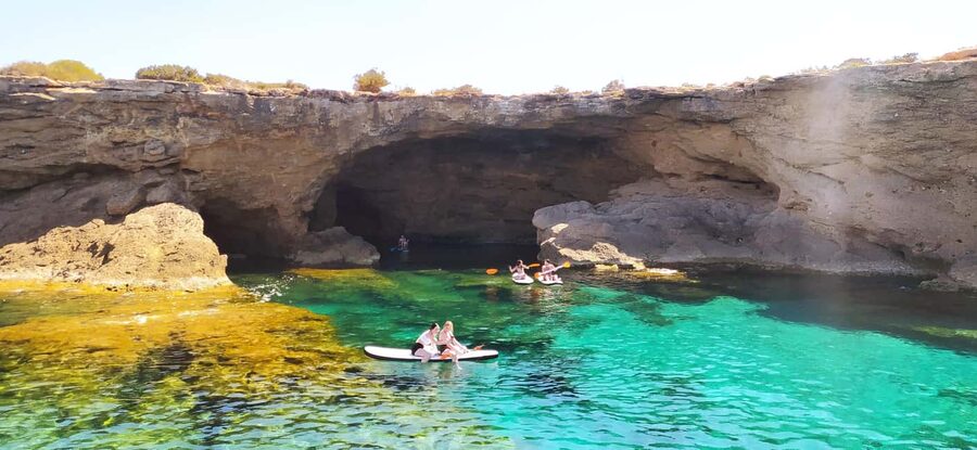 Ibiza: Snorkeling, Sunset Beach and Cave Boat Trip - Second stop: turquoise water and paddleboards