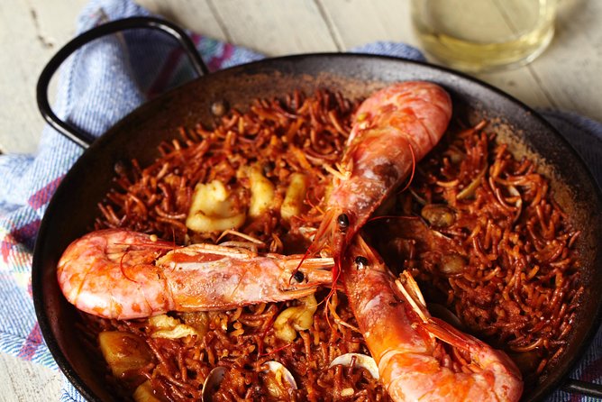 Interactive Paella & Market: Bottomless Wine & Rambla Views - Booking timing and cancellation details