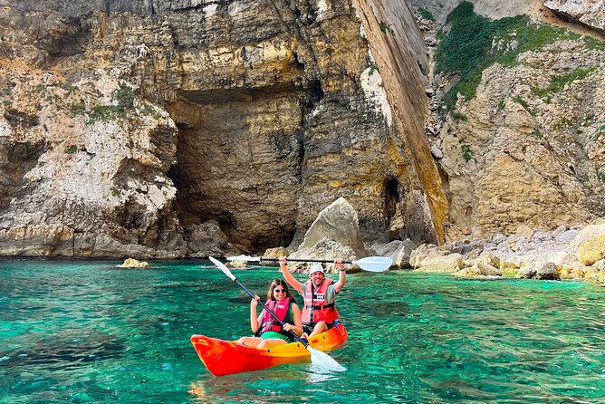Kayak Paradise: Cala Portixol Snorkel, Cave & Cliff Jumping Tour - Entering Isla de Portixol’s Caves