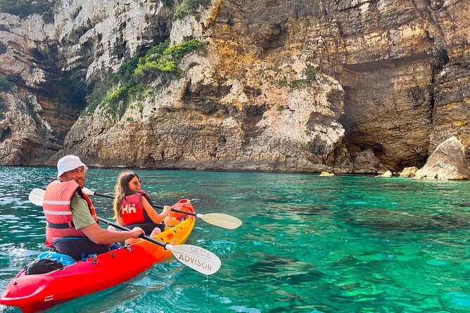 Kayak Paradise: Cala Portixol Snorkel, Cave & Cliff Jumping Tour - Looking Up at Cap Negre’s 100-Meter Rock Face