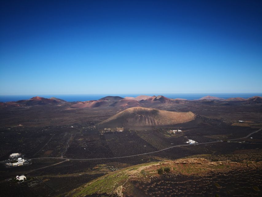 Lanzarote: La Geria Vineyards Hiking Tour - Walking through the black vineyards