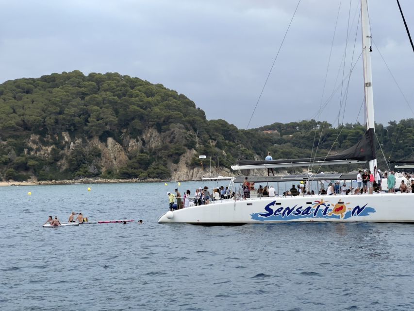 Lloret de Mar: Sunset Catamaran Cruise with DJ and Drinks - The Costa Brava shoreline from the water