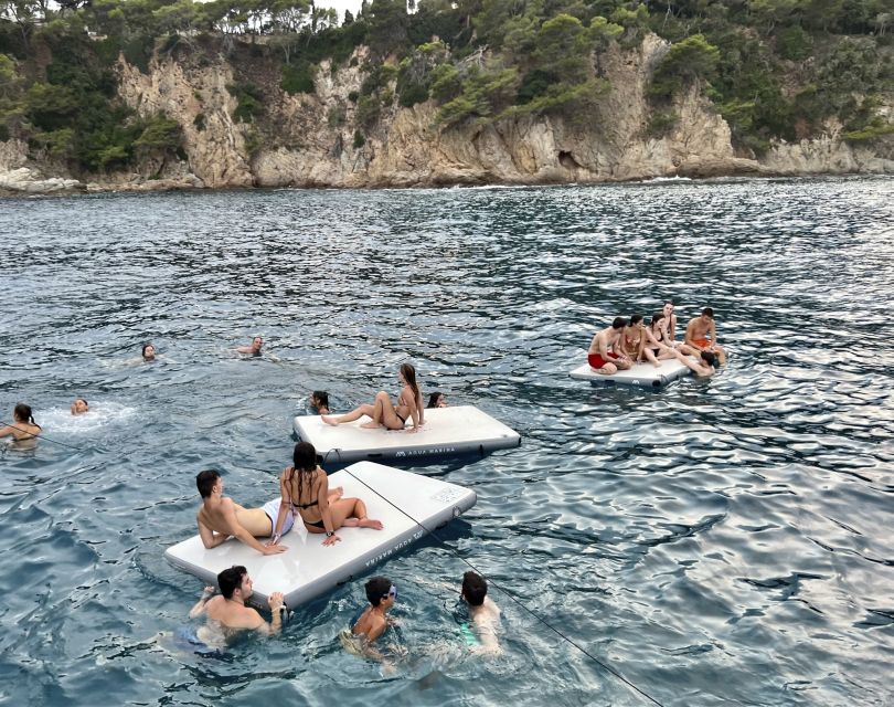 Lloret de Mar: Sunset Catamaran Cruise with DJ and Drinks - The quiet inlet and swimming stop