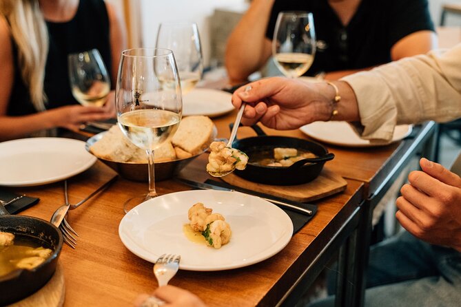 Madrid Tapas & Wine Tour with Rooftop Views and Local Guide - Garlic shrimp in the Literary Quarter