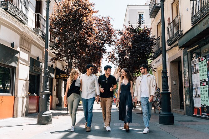 Madrid Tapas & Wine Tour with Rooftop Views and Local Guide - Iberian ham near Plaza Mayor