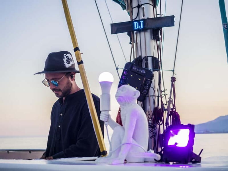 Malaga: Sailing Catamaran Sunset Cruise with Live DJ & Drink - Boarding at Málaga Port