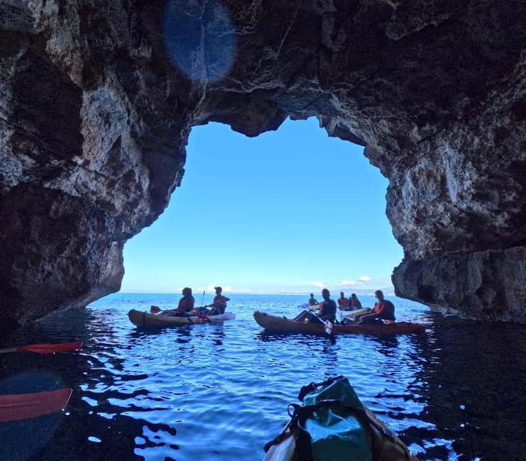 Mallorca: Sea Cave Kayaking Tour with Snorkeling and a Snack - Entering the colorful caves