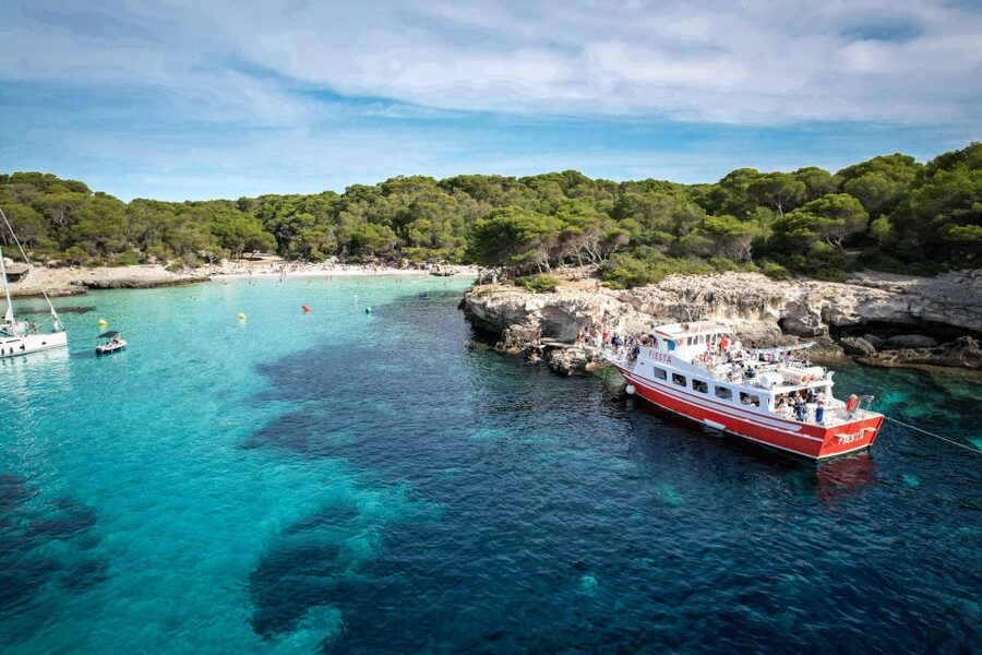Menorca: Full-Day Boat Tour with Paella Lunch - Son Saura: swimming, jumping, and a more open bay