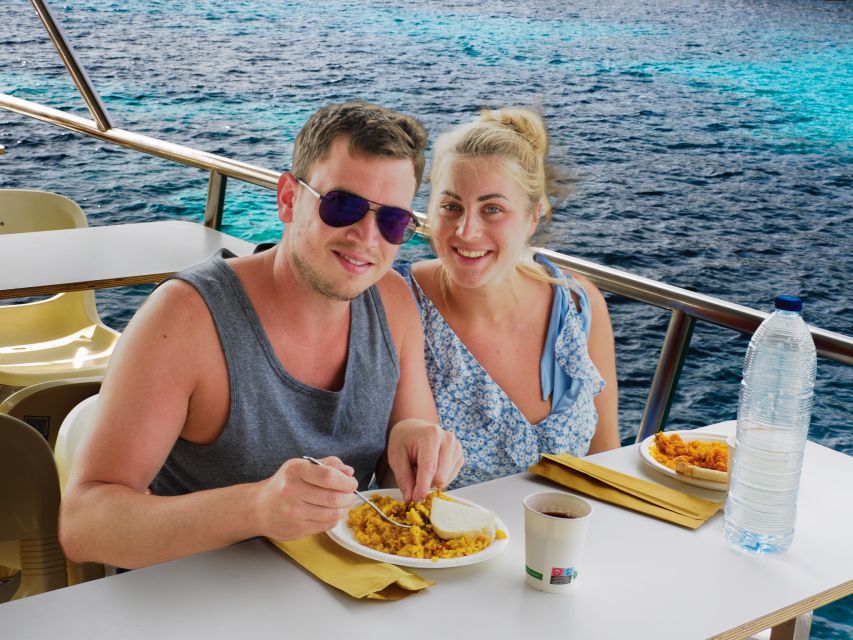 Menorca: Full-Day Boat Tour with Paella Lunch - Leaving Ciutadella on the red Fiesta boat