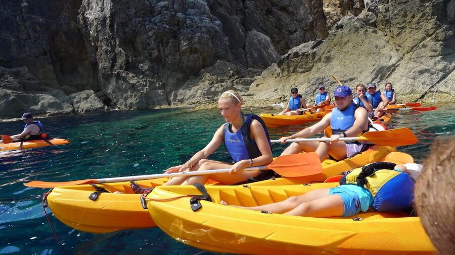 Menorca: Kayak and Marine Reserve Snorkeling Adventure - Paddling below La Mola de Fornells
