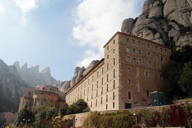 Montserrat Day Trip Private or Small Group with Basilica Tickets - Tasting Catalan products at the market