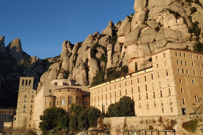 Montserrat Hiking Experience & Monastery Premium Small Group Tour - The Benedictine monastery and Catalan identity