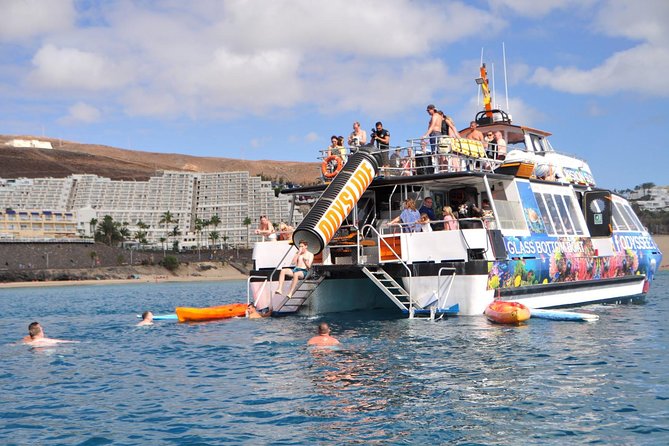 Odyssee 3: The Glass Bottom Boat Tour in Fuerteventura - The swim stop, slide, and paddle gear