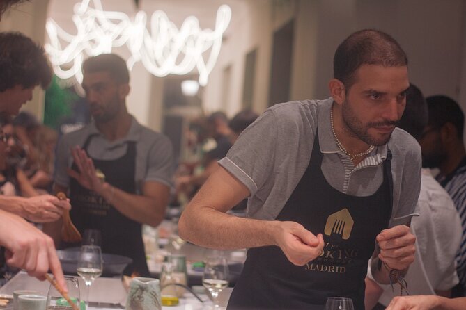 Paella Cooking Class in Madrid with Bottomless Wine Pairing - Building paella step by step