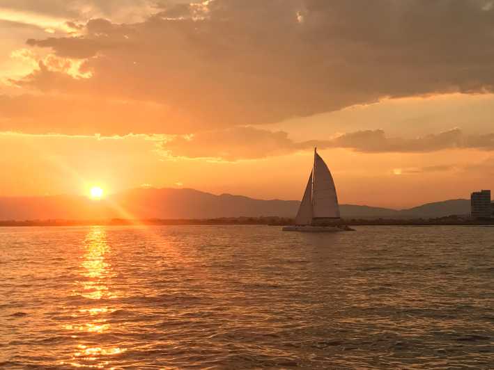 Palma de Mallorca: Sunset Sailing Catamaran Trip with Drink - Sailing out from Palma’s Auditorium