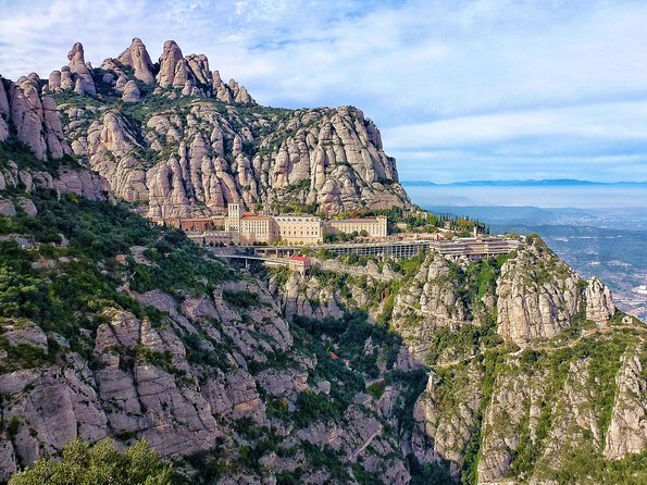 Panoramic Barcelona and Montserrat with Cog-Wheel Train - Passeig de Gràcia and Gaudí from the coach
