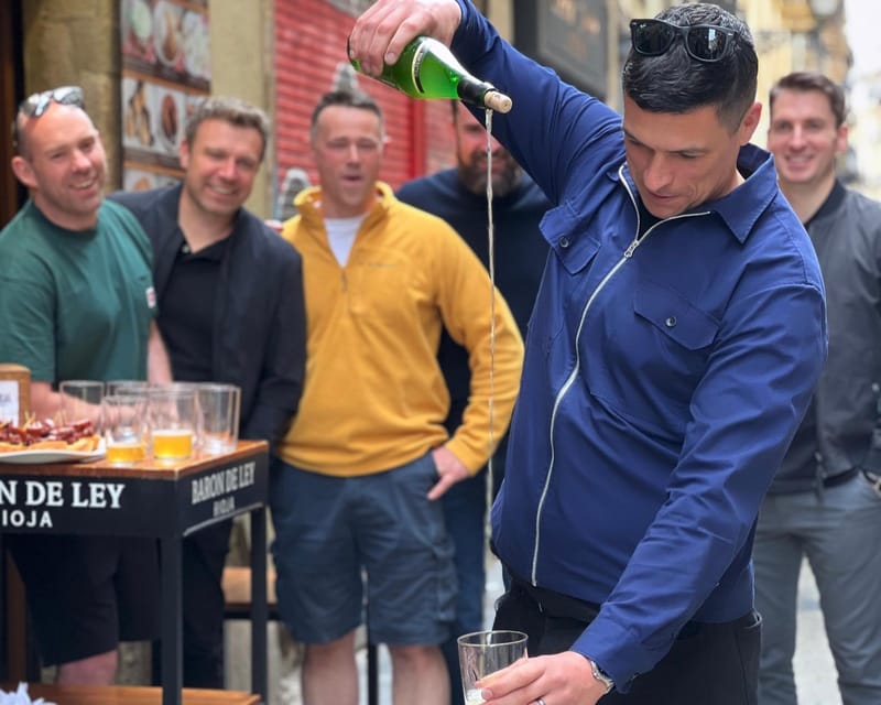San Sebastian: Market, Pintxos and Wine Tasting Tour - The market stop: ham, olives, oil, and Gilda