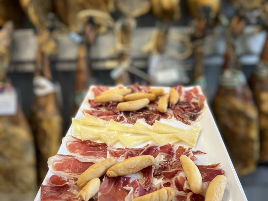 San Sebastian: Market, Pintxos and Wine Tasting Tour - Local wine, cider, and liqueur