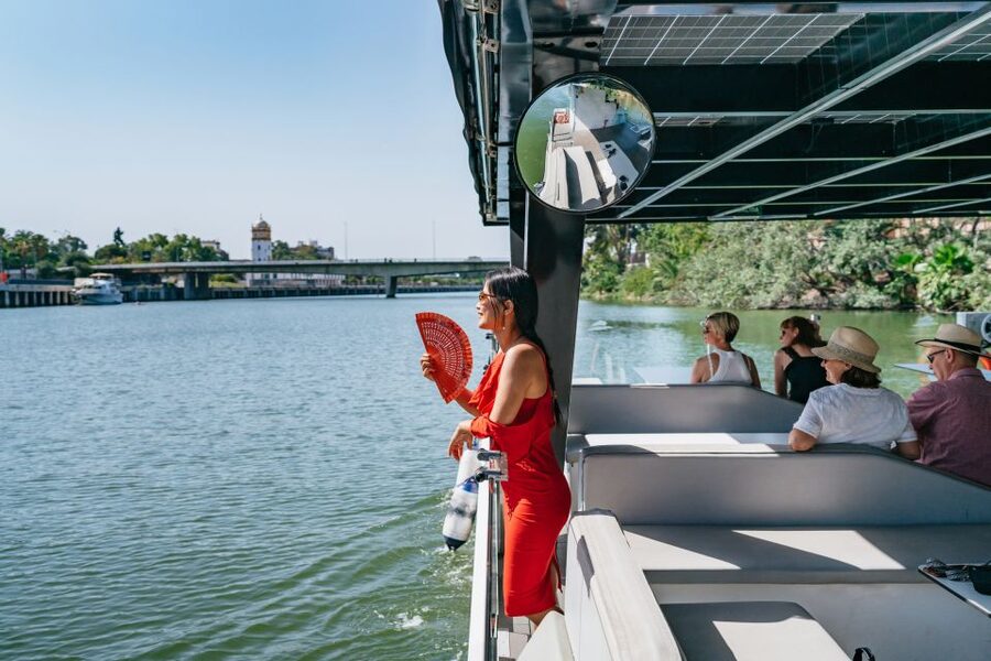Seville: 1-Hour Guadalquivir River Sightseeing Eco Cruise - Old towers beside newer Seville