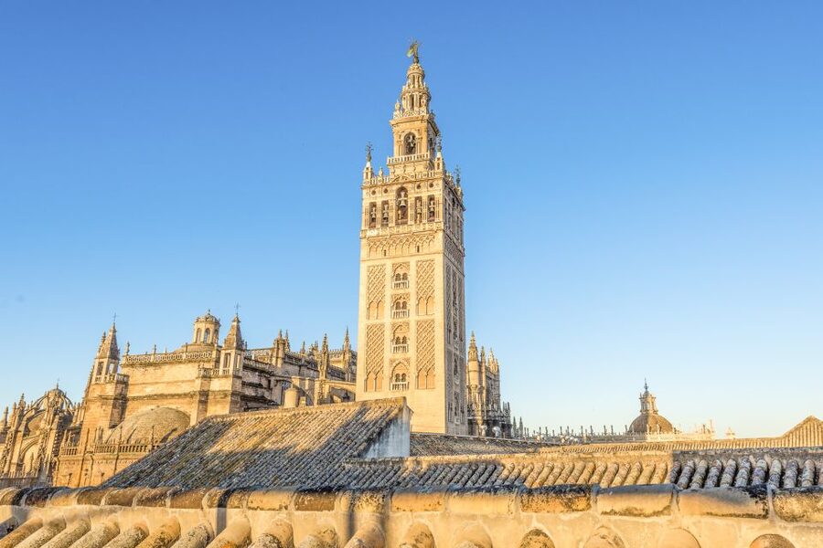 Seville Cathedral and Giralda Tower Guided Tour and Tickets - Inside the cathedral: paintings, windows, and tombs