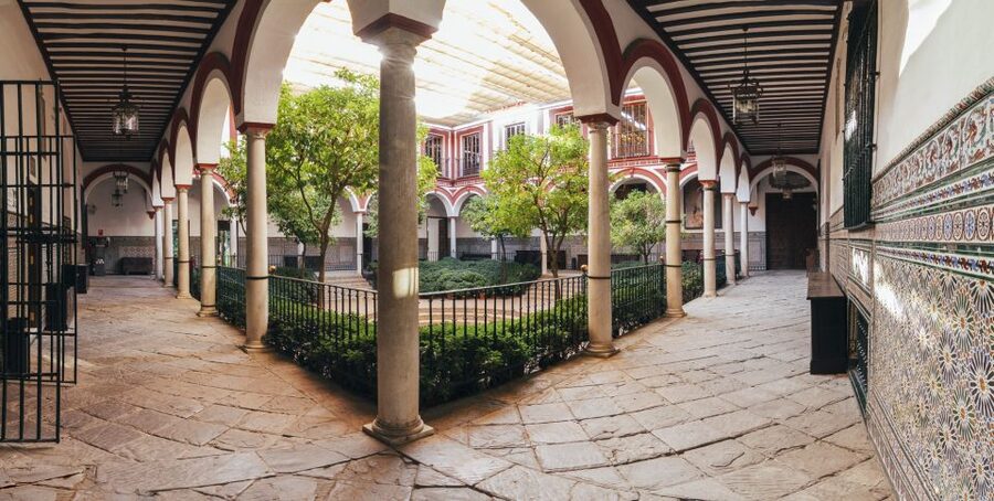 Seville: Hospital de los Venerables Ticket with Audio Guide - Entering through the courtyard and wooden gates