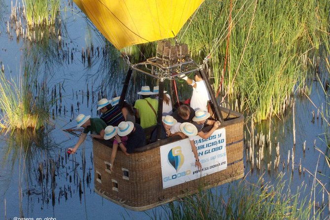 Seville Hot-Air Balloon Ride with Breakfast, Cava & Hotel Pick up - Floating above fields, rivers, and Seville