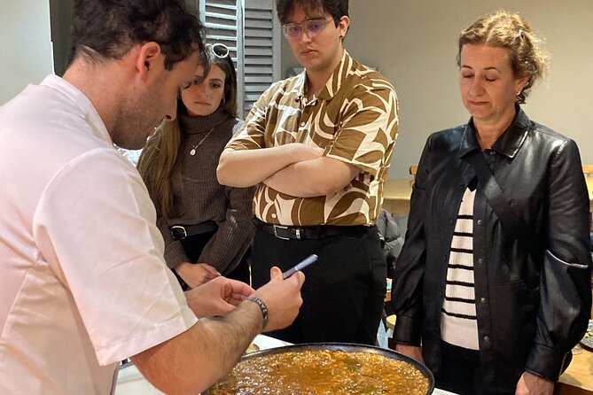 Seville: Paella Showcooking Experience - Eating paella on the terrace