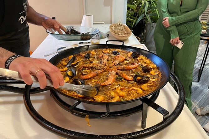 Seville: Paella Showcooking Experience - Starting with Andalusian snacks and local drinks