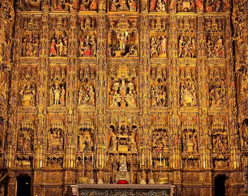 Seville: Priority Access Cathedral & Giralda Tour - Entering through the Patio de los Naranjos
